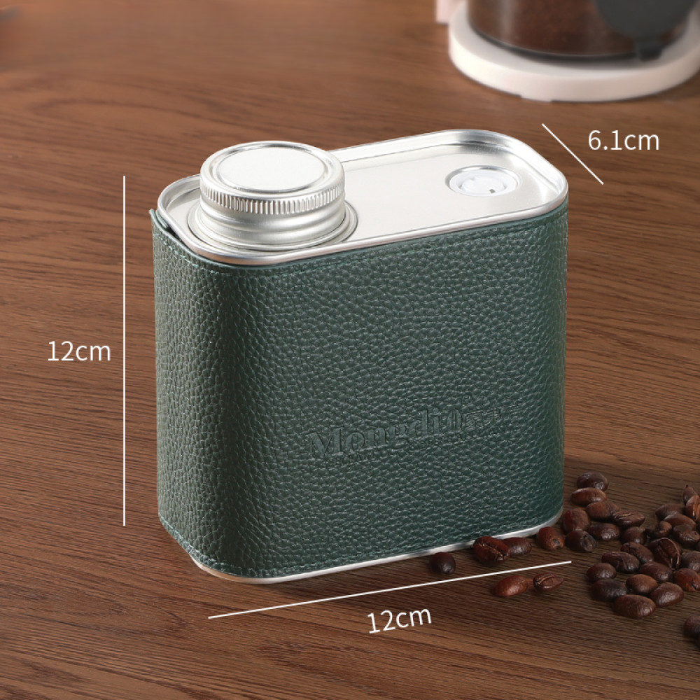 Grüne Kaffeedose aus Metall mit Einwegventil – bewahrt Aroma und Frische durch luftdichten Verschluss.